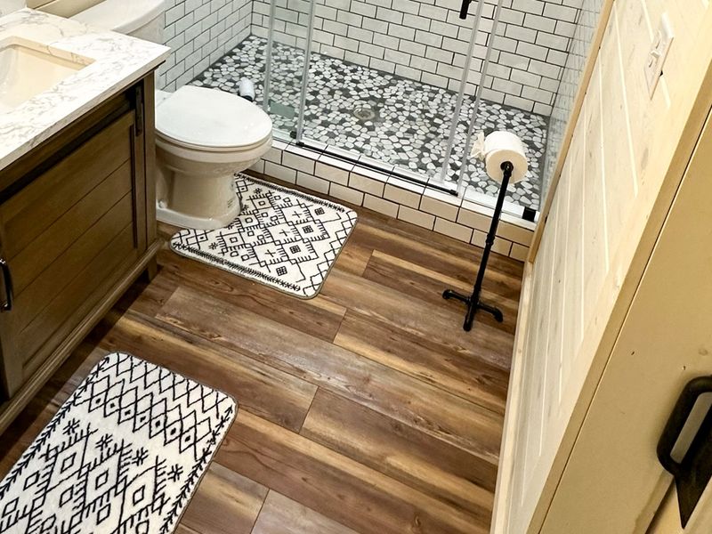Bedroom 4's ensuite featuring a contemporary shower and sink.