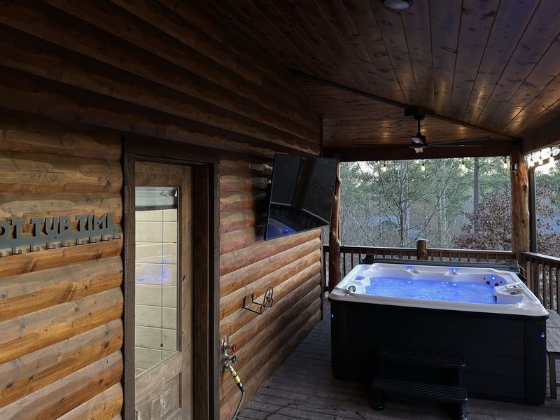 Indulge in pure bliss as you unwind in our hot tub beneath the twinkling night sky, where the serenity of the stars above melts away all cares below