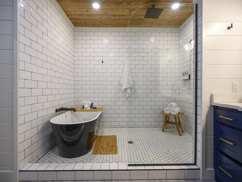 "Step into luxury with ensuite bathrooms featuring freestanding soaker tubs and oversized walk-in showers."