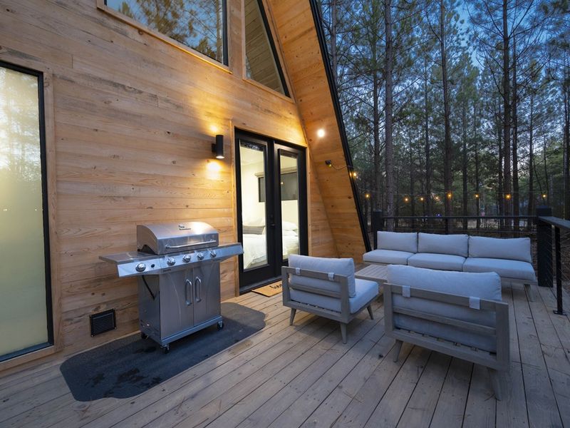 "Enjoy the ease of outdoor cooking with a hard-line gas grill, perfect for gatherings under the open sky."