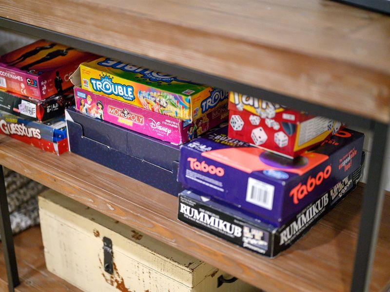 Let the game night begin! 🎲 Check out our board game collection that's stacked and ready for some serious fun.