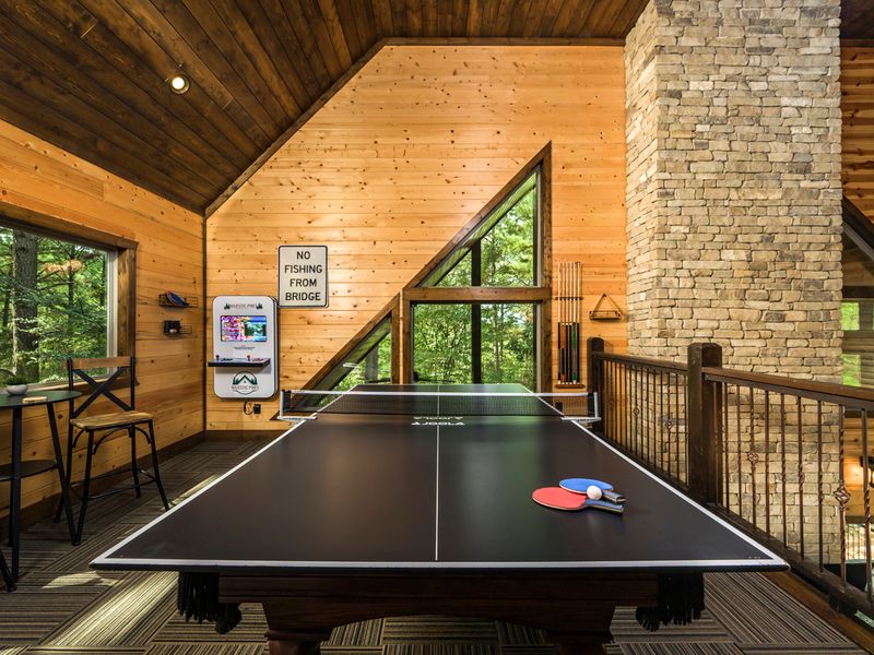 Enjoy cozy game nights and friendly competition around the pool table in your private cabin retreat.