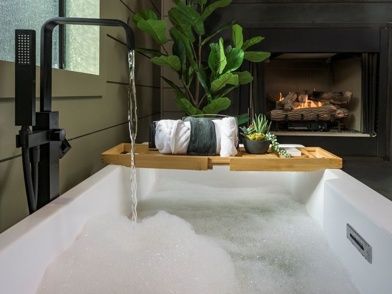 Soak, sip, and unwind — a deep tub by the fire sets the scene for pure relaxation and romantic evenings