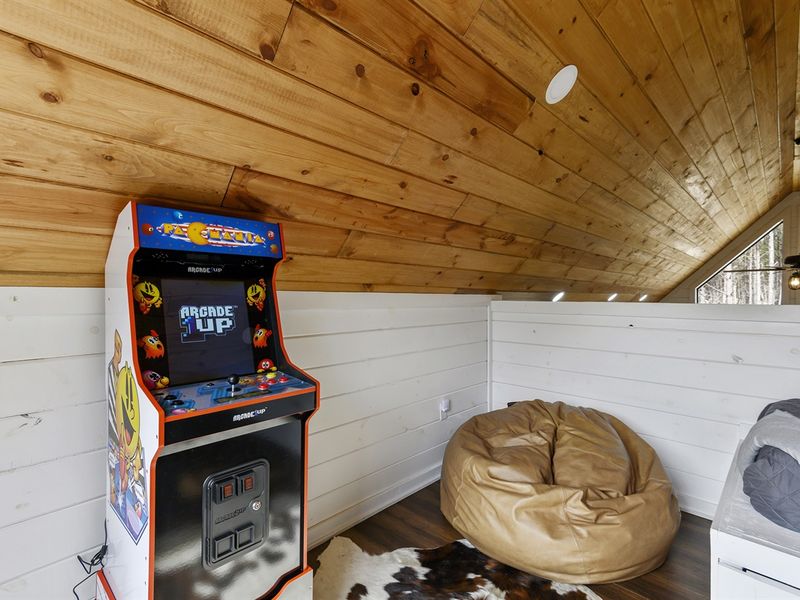 Bring the kids and let them explore the loft area complete with a twin bed, trundle, and retro arcade game. Fun for all ages awaits!