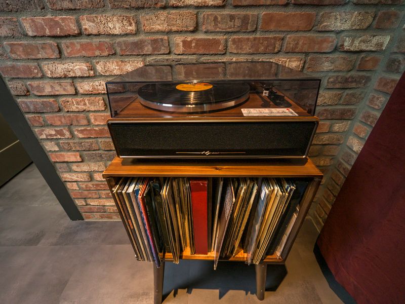 Enjoy the nostalgic charm of the vintage record player and browse the collection of vinyl records for the perfect soundtrack to your evening.
