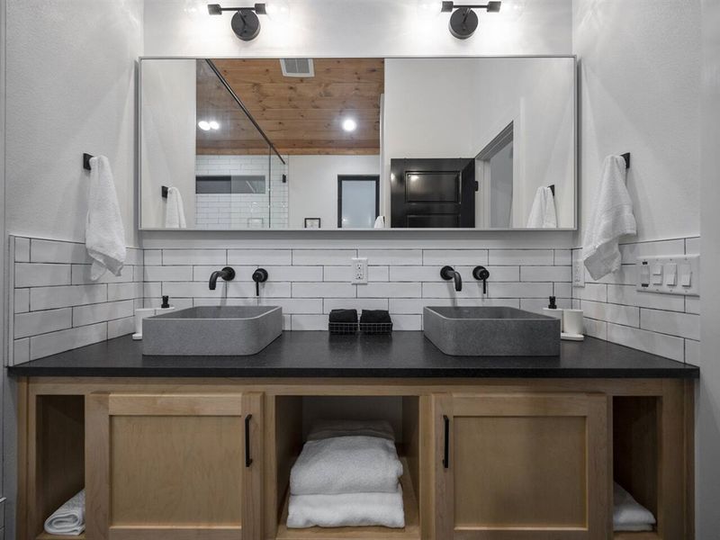 Double vanities with wall-mounted fixtures