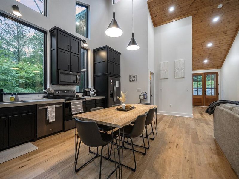 Dining table with pendant lighting overhead