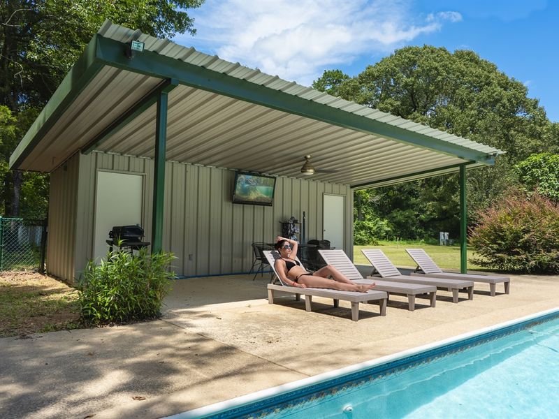 A serene poolside oasis, perfect for lounging and cooling off.