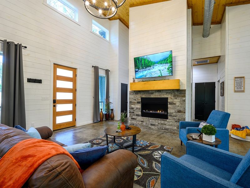 Cozy up by the fire with plush pillows and soft throws — your perfect cabin comfort spot. 🔥🕯️
