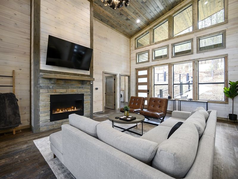 Embrace the warmth and charm of this wood-ceilinged living room, the perfect spot to unwind