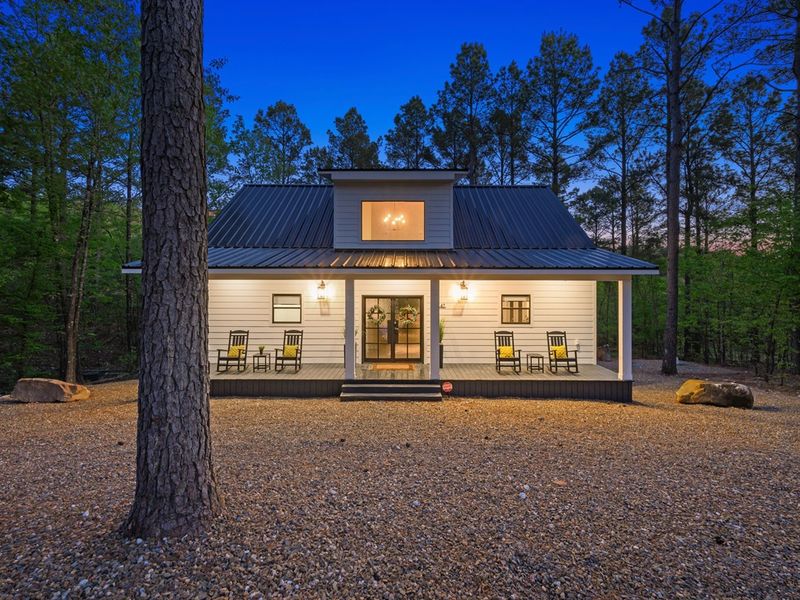 Adorable front porch with rocking chairs.
