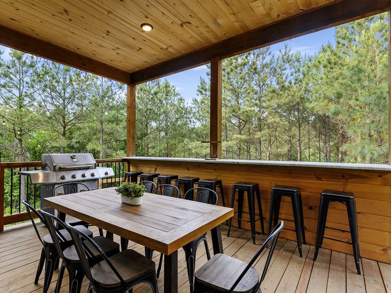 Downstairs deck has plenty of seating for dining outdoors