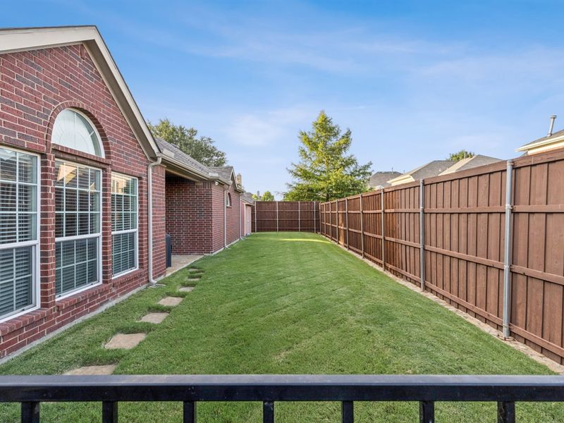 Covered patio with grill and grassy play space for your kids or furbabies.
