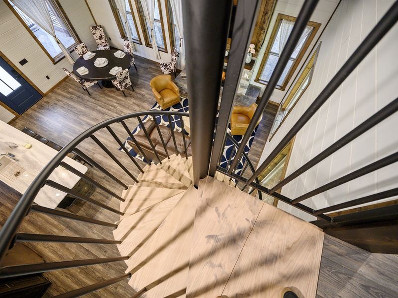 Head up the spiral staircase to the loft above
