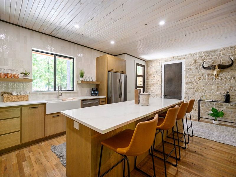 Warm hardwood meets rustic stone, Natural textures for a welcoming feel