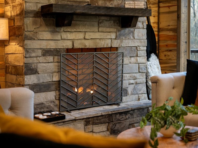 Relax by the stone fireplace and enjoy cozy evenings together.