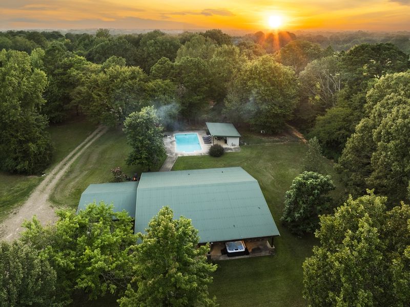 Aerial view of our 10 Acres of Land with a main house and 6 airstreams for your group to enjoy!