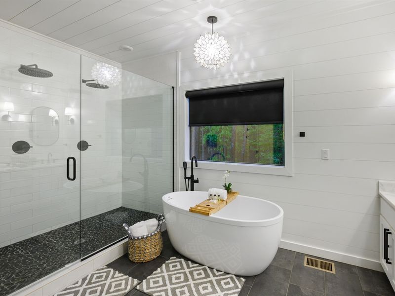 Soaking tub and spacious shower with two large rainfall shower heads