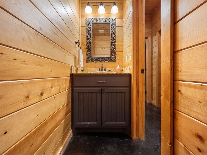 The half bath is conveniently located downstairs.