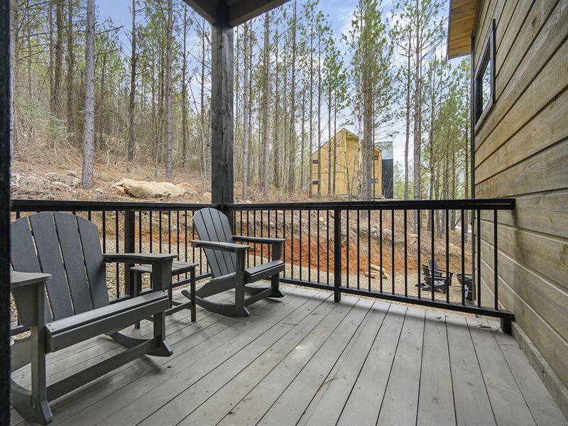Embrace the serenity of the great outdoors from the comfort of our charming private patio overlooking lush greenery.