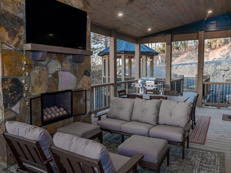 Outdoor living done right; TV for the game, grill for the feast, and couches for the squad.