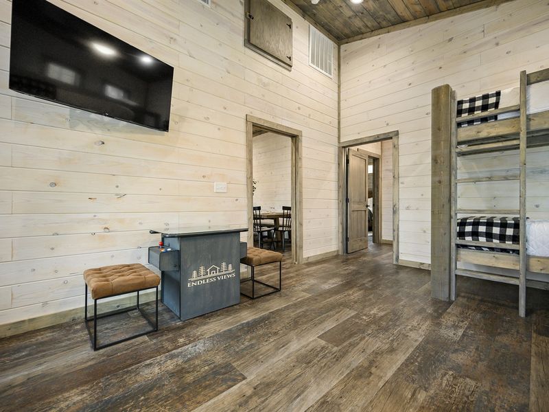 Kick back and relax on this stacked bunk bed after a day of wandering the woods
