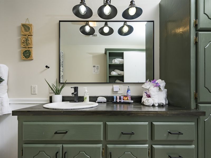 "En-suite bathroom with walk-in shower and elegant fixtures."