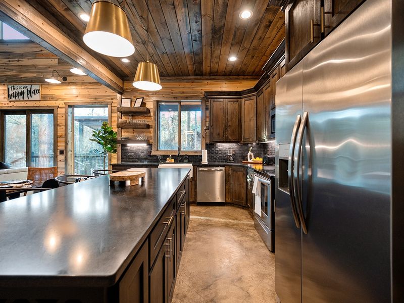 Brass lighting and rich wood tones set the mood for cabin living.