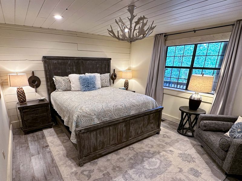 Sleep like a king or queen in our expansive bedroom with a regal king bed as the centerpiece.