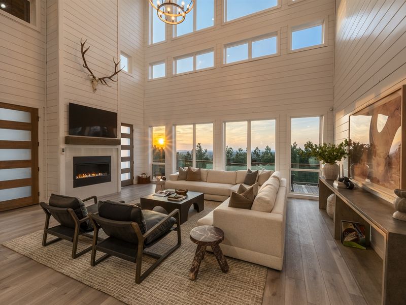Floor-to-ceiling windows flooding the space with natural light and views