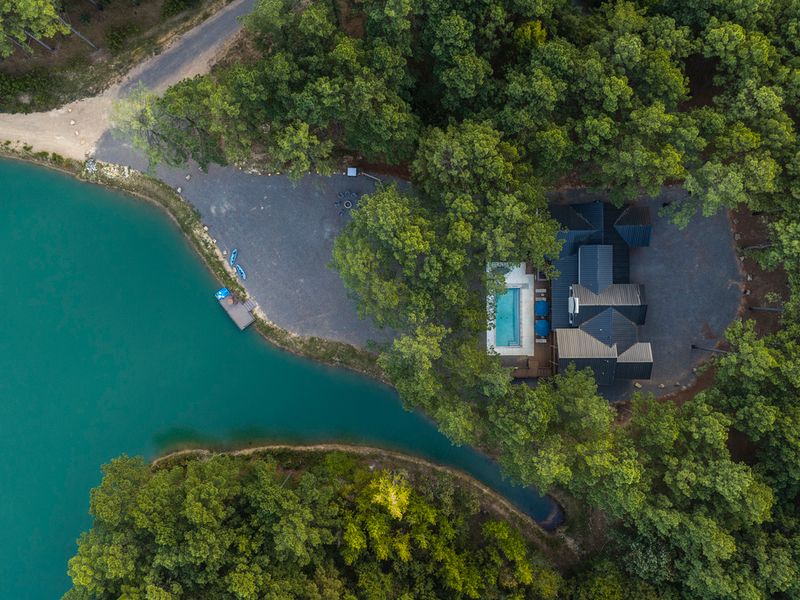 Aerial view of Bear Lake Lodge, a luxury vacation rental property, showcasing its private pool