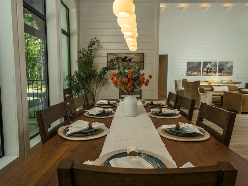 Elegant dining room at Bear Lake Lodge, featuring a large farmhouse-style table set