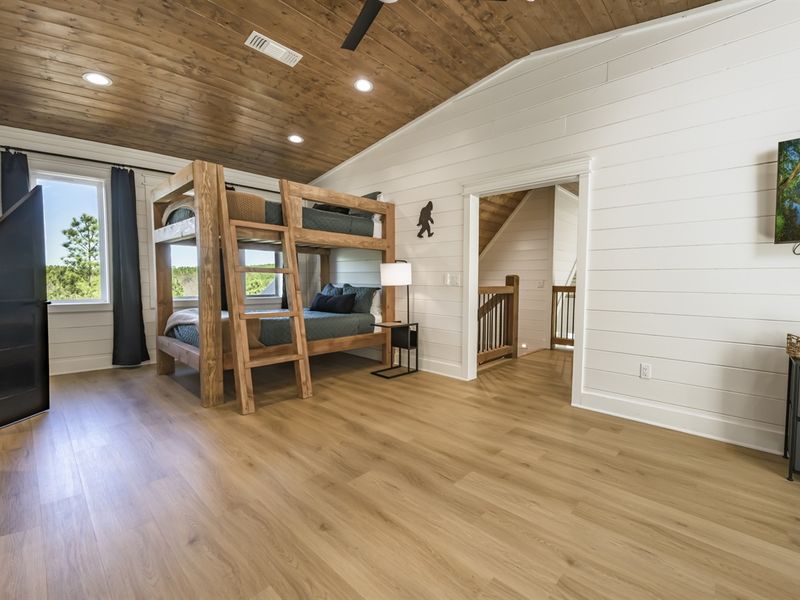 Tucked away in the loft, this room offers a private escape for the younger guests.