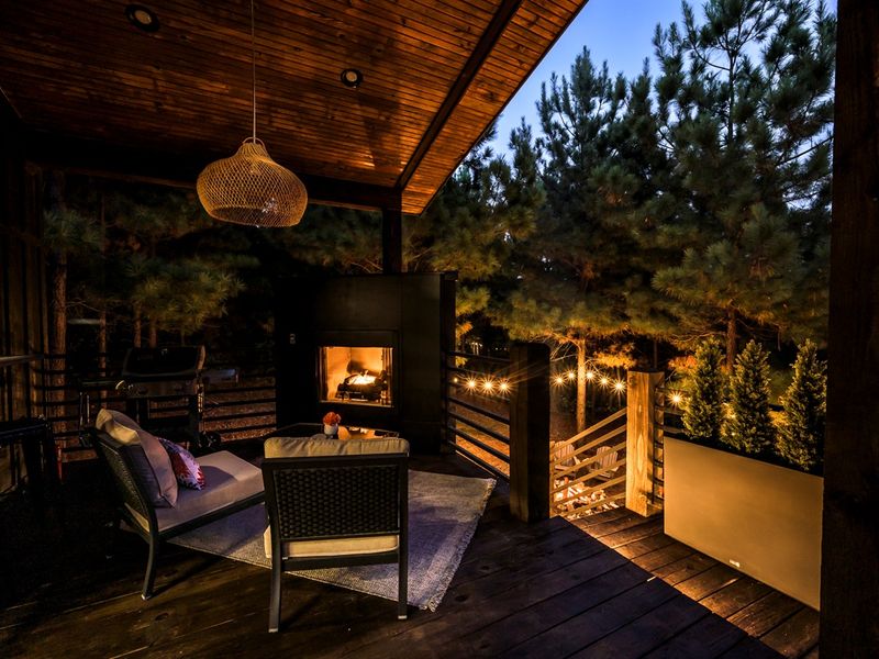 🔥“Evenings by the fire just hit different here — relax on the deck, wrapped in nature and soft, golden light.”