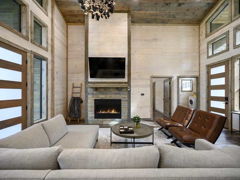 Escape to the tranquility of this woodsy sanctuary, boasting a roaring fireplace that beckons you to relax and rejuvenate.