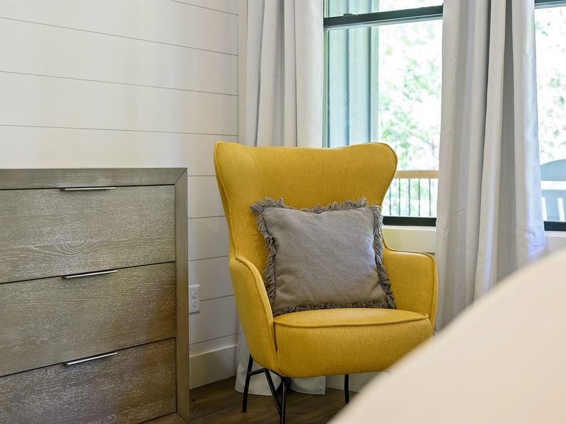 Take a seat in the primary bedroom