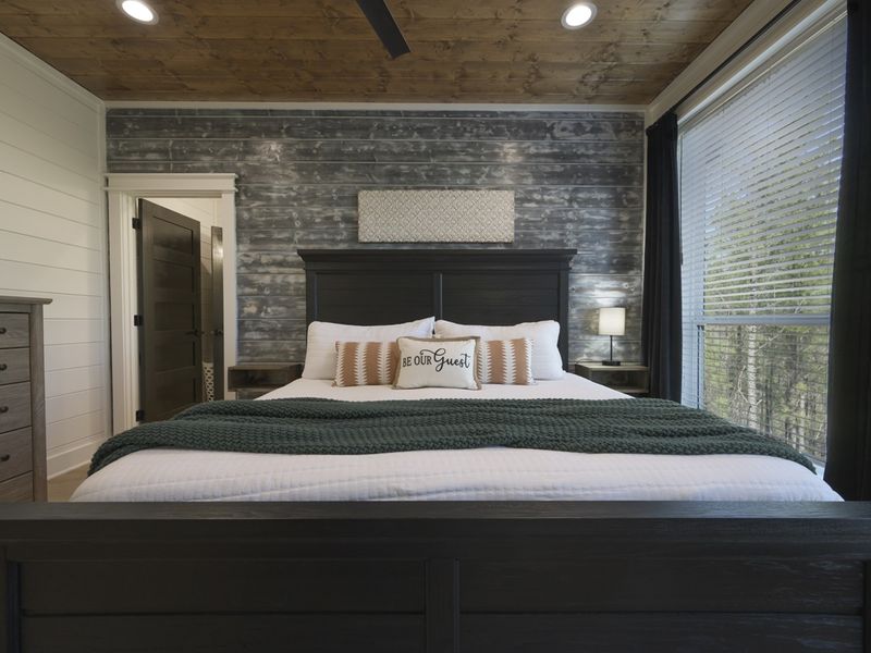 Wake up to serene forest views in this luxurious king suite.