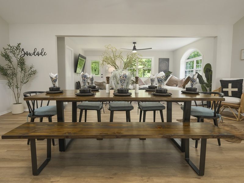 "Bright and inviting dining room with seating for all your guests."