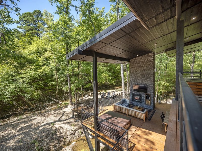 modern design suspended in the trees — with a private creek below