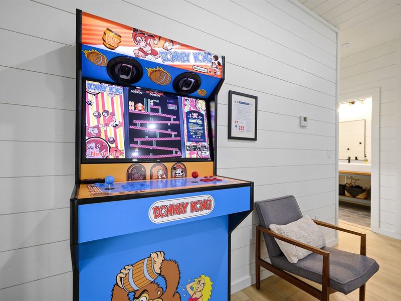 Step into nostalgia with our arcade room—retro fun for the modern gamer.
