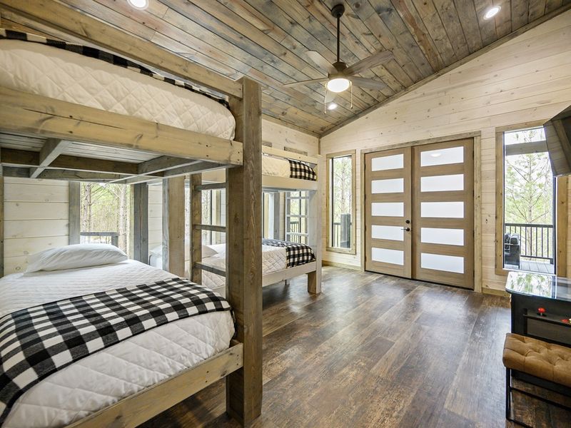Embrace the charm of wooden floors and a bunk bed setup