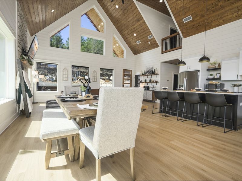 Enjoy sunlit mornings in this charming cabin featuring large windows throughout. Nature awaits just outside your door
