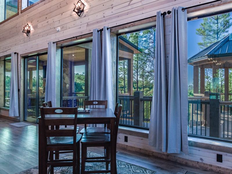 Where cozy meets scenic - gather 'round the table, steps away from family room comfort.