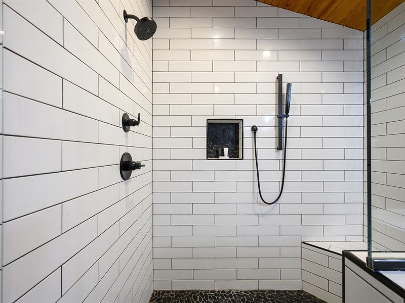 Walk-in shower with multiple shower heads