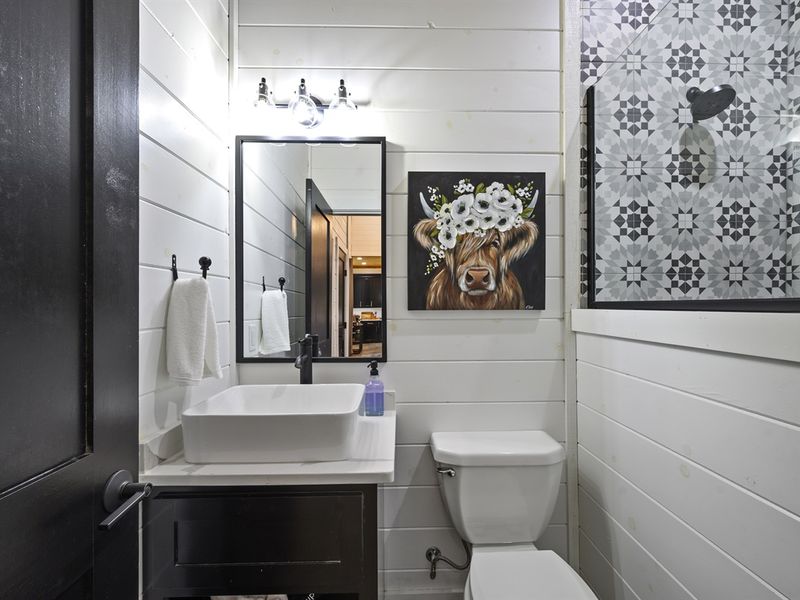 Hallway bathroom is close to the bunk beds
