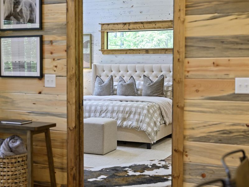 "Retreat into sophistication with plush comforts and a 55" Smart TV in our first master suite."