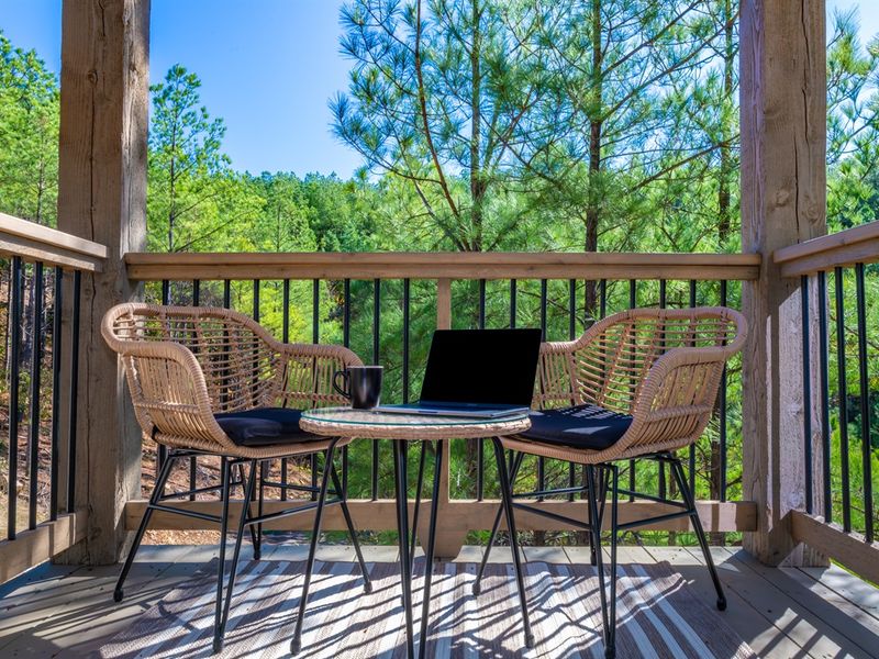 Bistro charm meets forest magic - your perfect retreat. Deck off of Bedroom 1