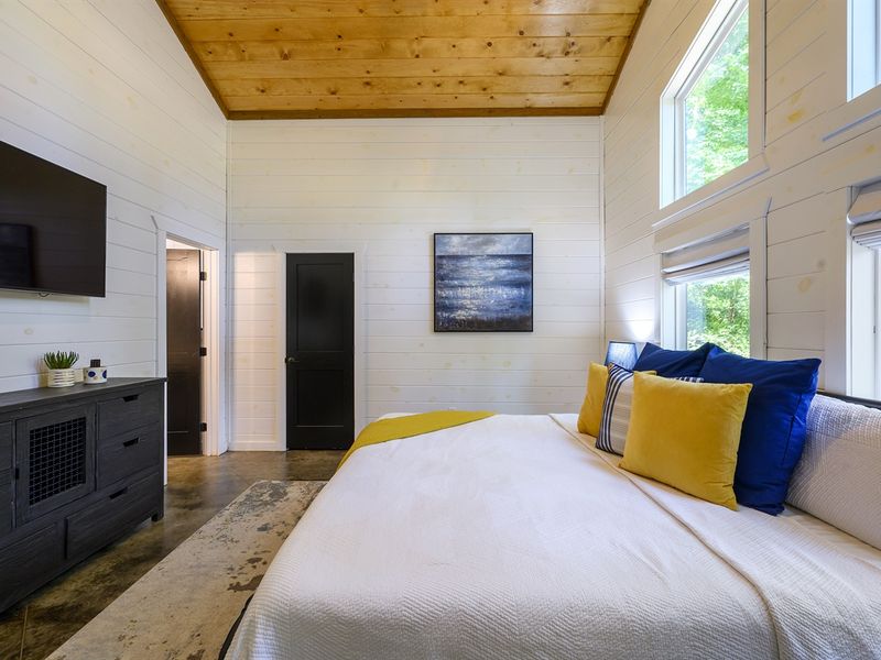 "Enjoy your favorite shows in bed with the flat-screen TV in the primary bedroom."