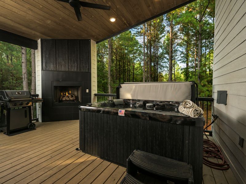 Your perfect evening: a fire, a relaxing hot tub soak, and peaceful forest surroundings.