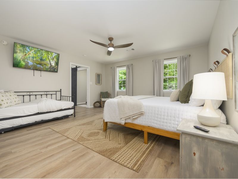 Soft lighting and comfortable bedding make Bedroom 2 a serene escape.